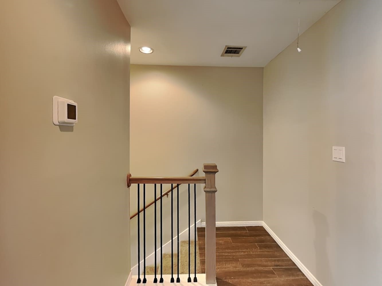 179 Holly Street, Unit 102 Georgetown, TX 78626 - Photo 6 of 17 a view of a hallway with wooden floor