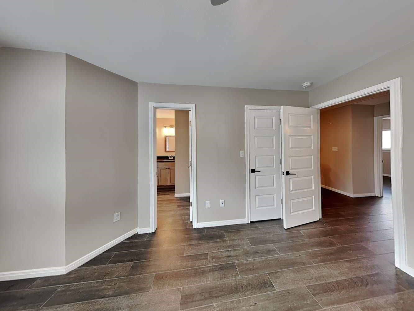 179 Holly Street, Unit 102 Georgetown, TX 78626 - Photo 10 of 17 a view of empty room with wooden floor
