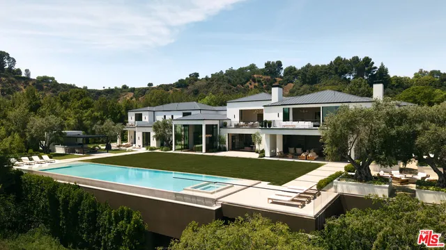 an aerial view of a house with a garden