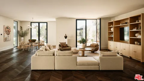 a white couch sitting next to a white wall