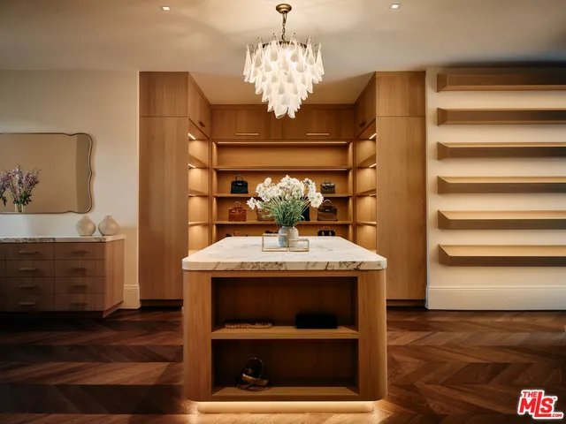 a kitchen with stainless steel appliances granite countertop a stove a refrigerator and a sink