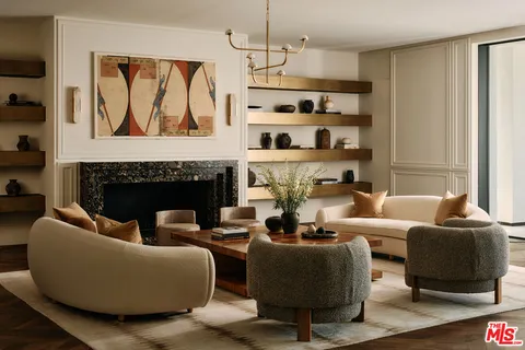 a kitchen with stainless steel appliances granite countertop a sink a stove and a wooden cabinets