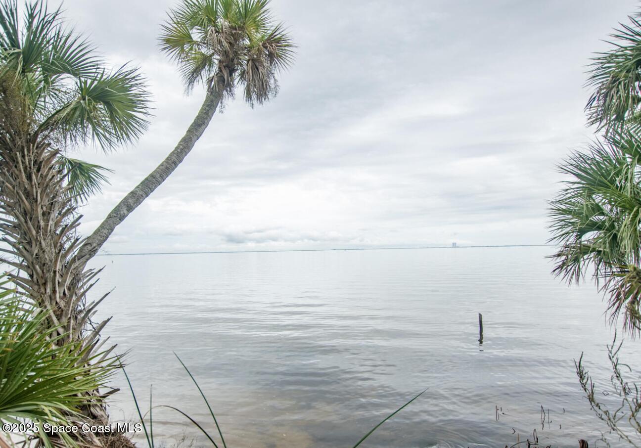 5122 Riveredge Drive Titusville, FL 32780 - Photo 11 of 15 a view of beach and palm tree