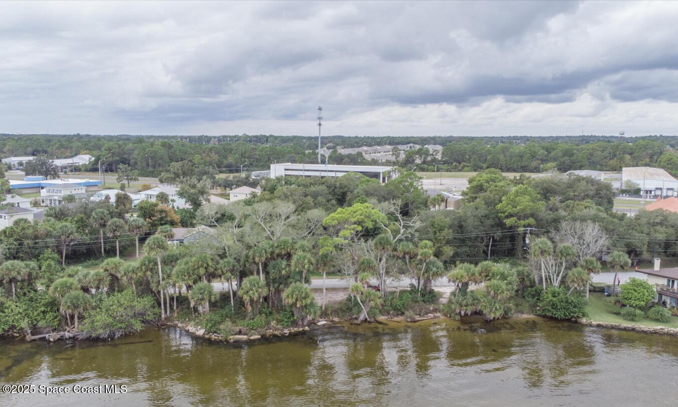 5122 Riveredge Drive Titusville, FL 32780 - Photo 12 of 15 a view of a lake with houses in the back