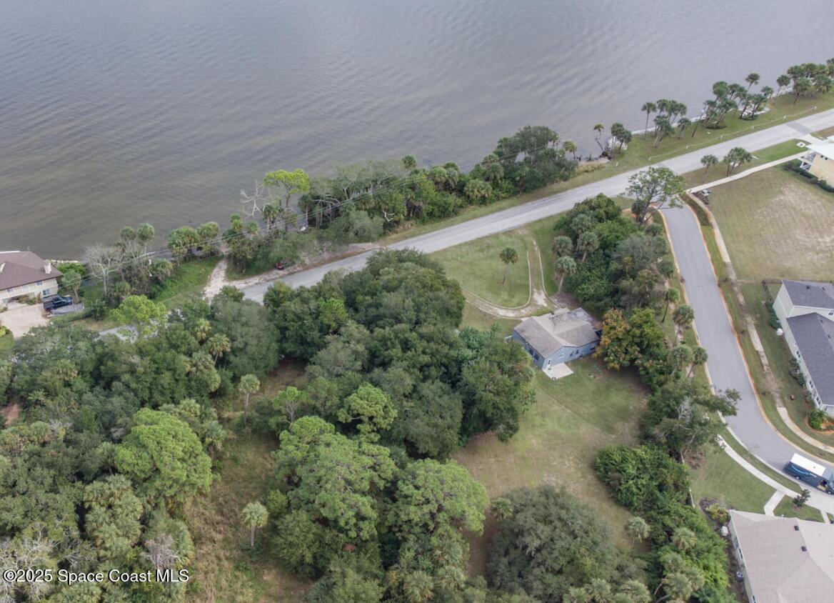 5122 Riveredge Drive Titusville, FL 32780 - Photo 13 of 15 an aerial view of a house with a yard