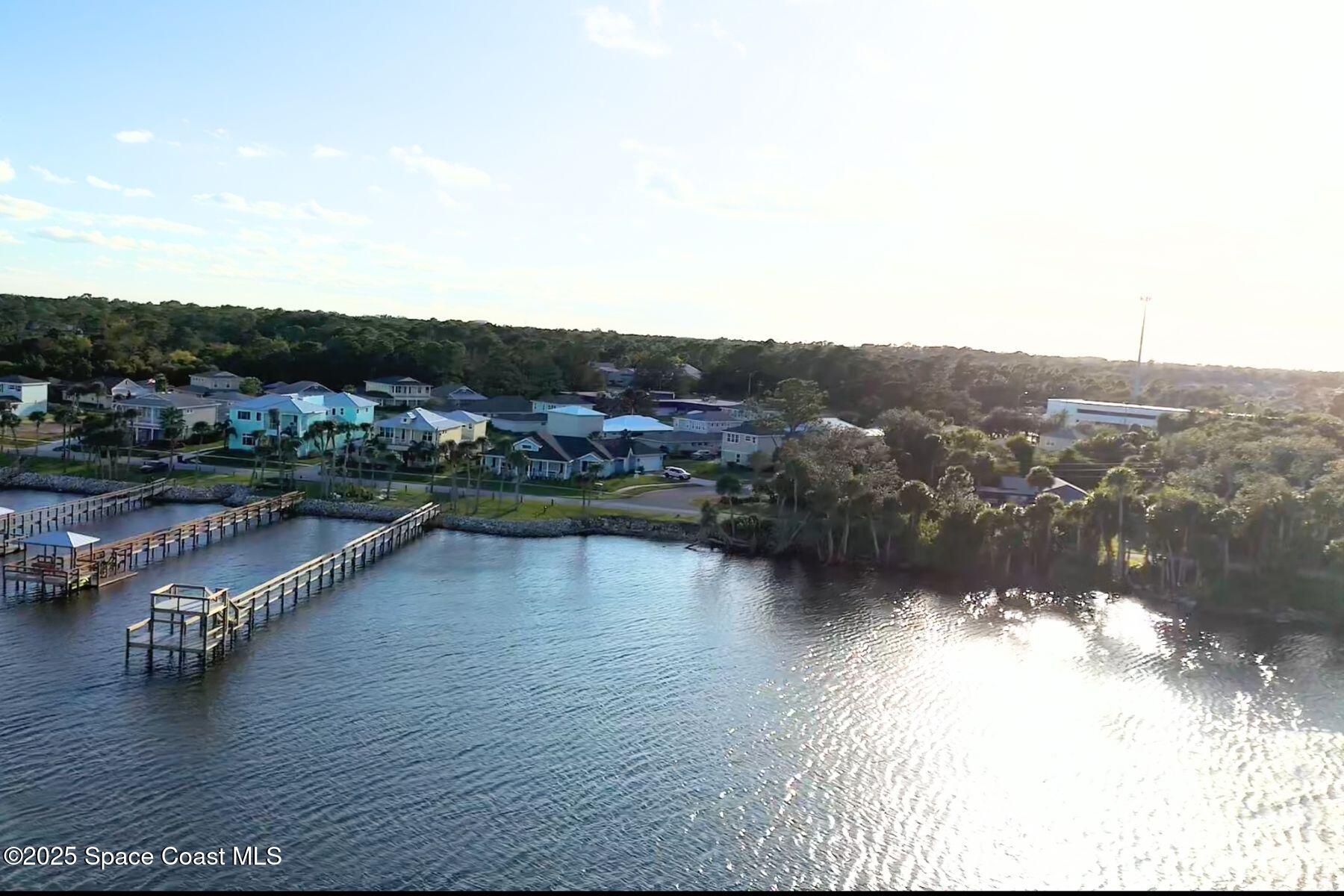 5122 Riveredge Drive Titusville, FL 32780 - Photo 3 of 15 a view of a lake view