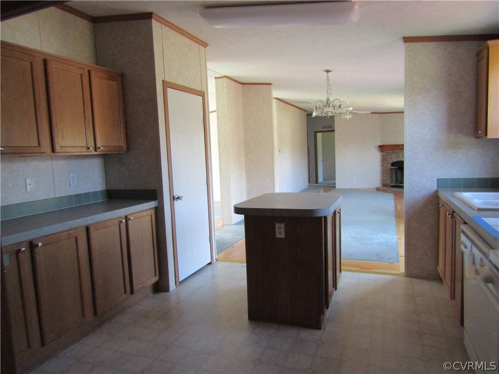 17622 Fox Branch Road Carson, VA 23830 - Photo 16 of 30 a view of kitchen and hallway with fireplace
