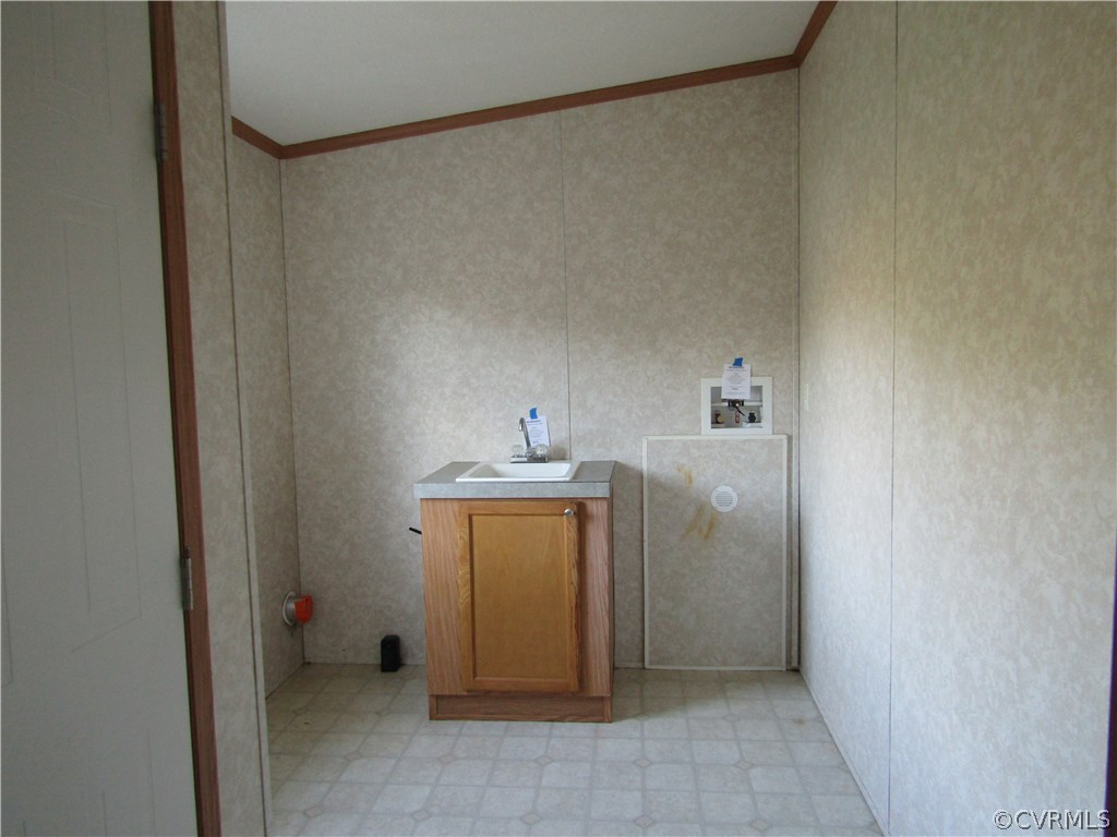 17622 Fox Branch Road Carson, VA 23830 - Photo 17 of 30 a utility room with a sink dryer and washer
