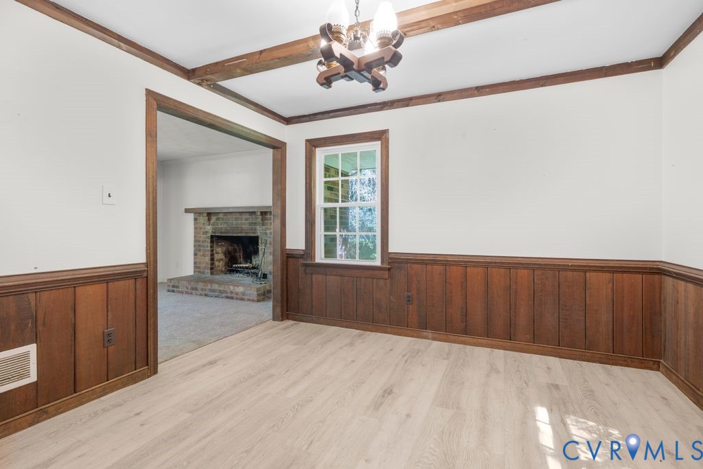 16064 Binns Road Doswell, VA 23047 - Photo 11 of 35 a view of an empty room with a fireplace and a window