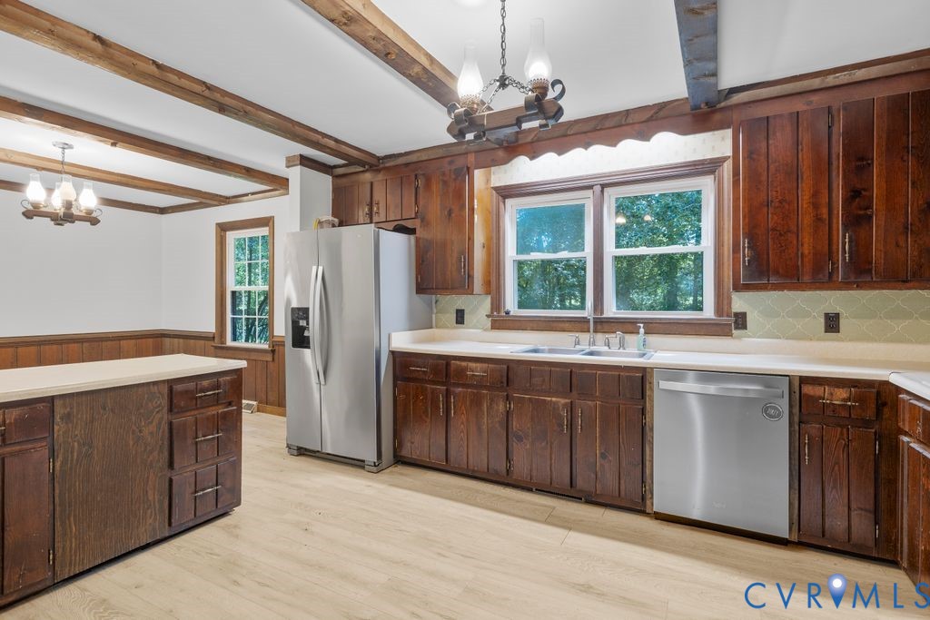 16064 Binns Road Doswell, VA 23047 - Photo 14 of 35 a kitchen with stainless steel appliances granite countertop a sink stove and refrigerator