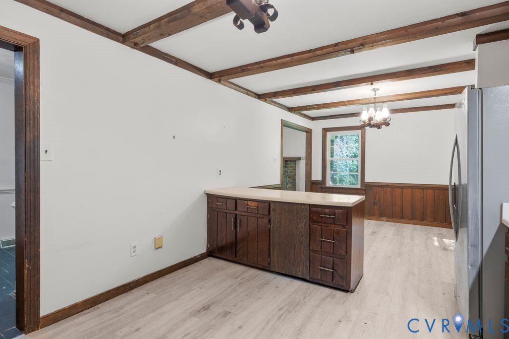 16064 Binns Road Doswell, VA 23047 - Photo 15 of 35 a kitchen with wooden cabinets and a sink