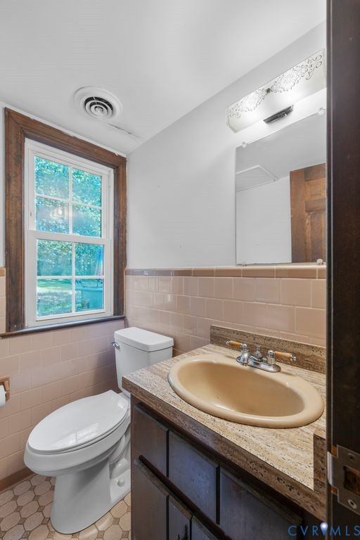 16064 Binns Road Doswell, VA 23047 - Photo 17 of 35 a bathroom with a sink and a toilet