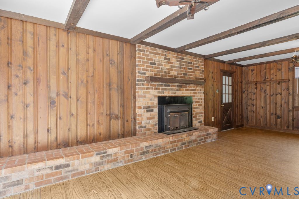 16064 Binns Road Doswell, VA 23047 - Photo 20 of 35 a view of an empty room with a fireplace and a window