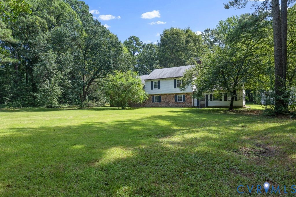 16064 Binns Road Doswell, VA 23047 - Photo 2 of 35 a front view of a house with a yard
