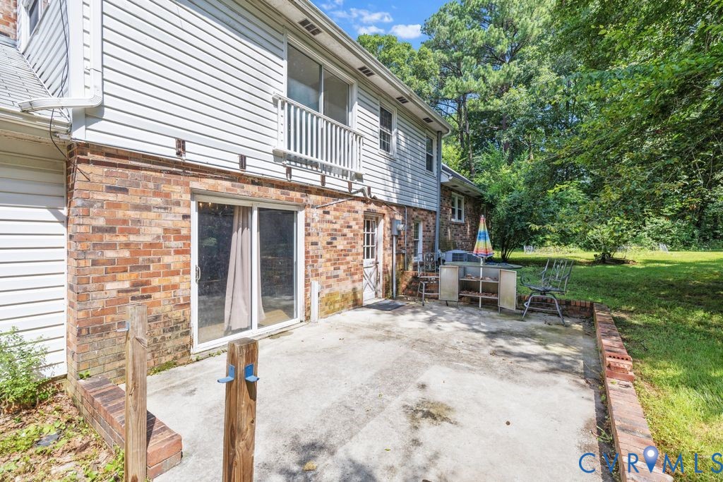 16064 Binns Road Doswell, VA 23047 - Photo 30 of 35 a view of a house with a patio