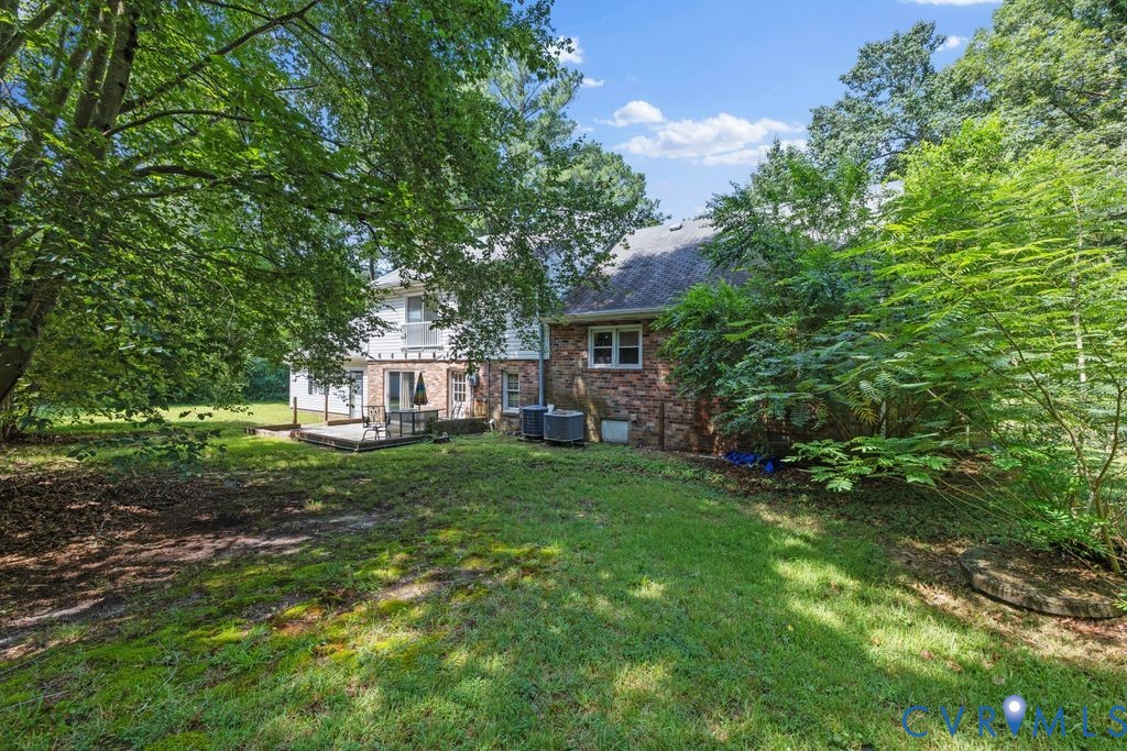 16064 Binns Road Doswell, VA 23047 - Photo 31 of 35 a view of a house with a backyard