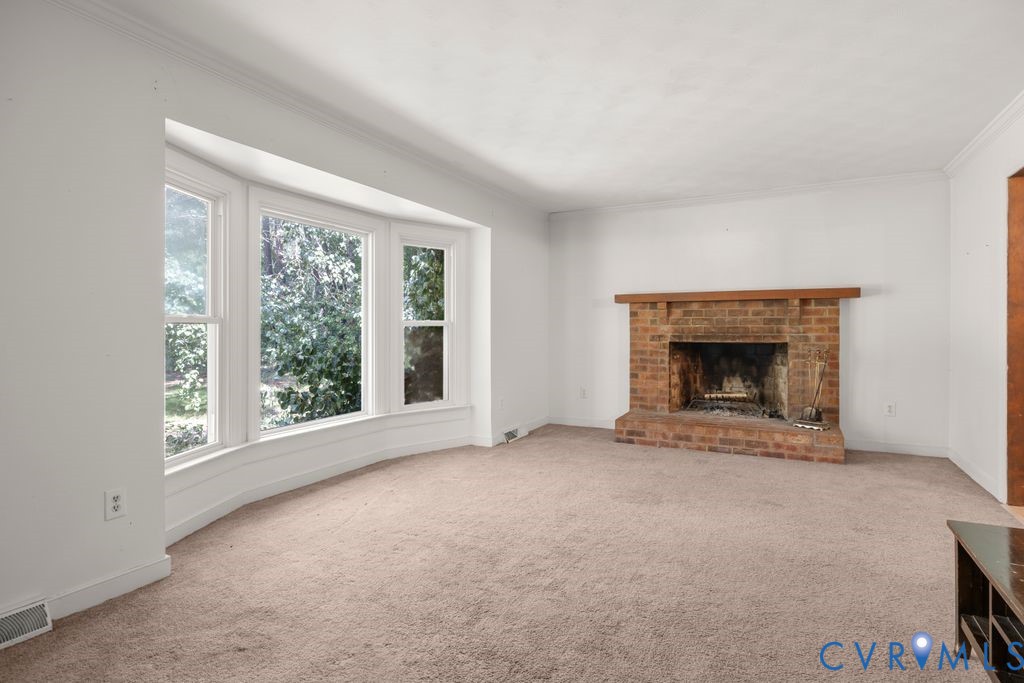 16064 Binns Road Doswell, VA 23047 - Photo 8 of 35 an empty room with windows and fireplace