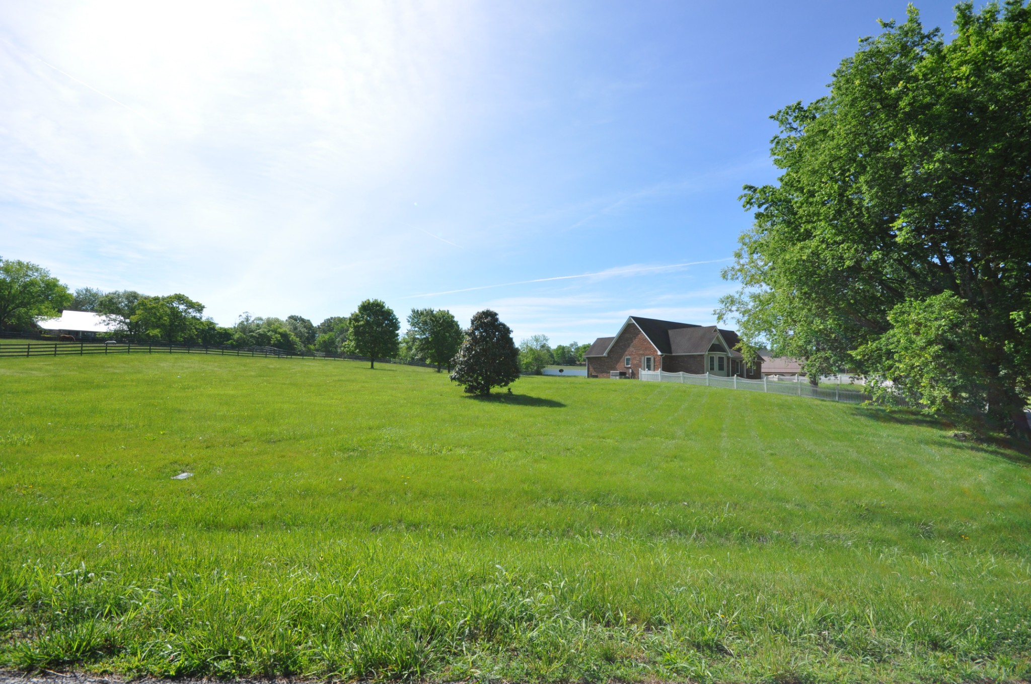 5620 Sango Road Cedar Hill, TN 37032 - Photo 1 of 37 a view of a green field with trees in the background