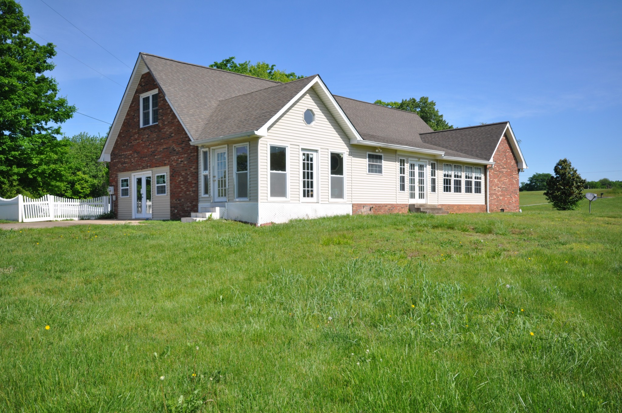 5620 Sango Road Cedar Hill, TN 37032 - Photo 12 of 37 a front view of a house with a garden and yard