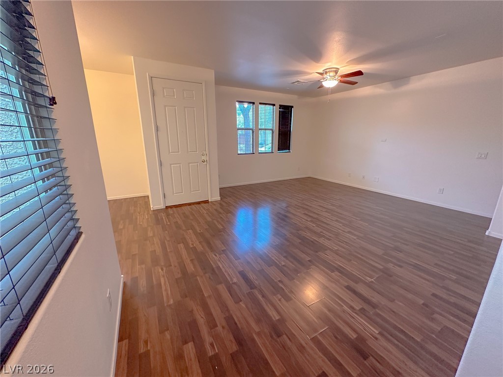 10934 Ketchikan Street Las Vegas, NV 89179 - Photo 22 of 30 Spare room with dark wood-style flooring and ceiling fan