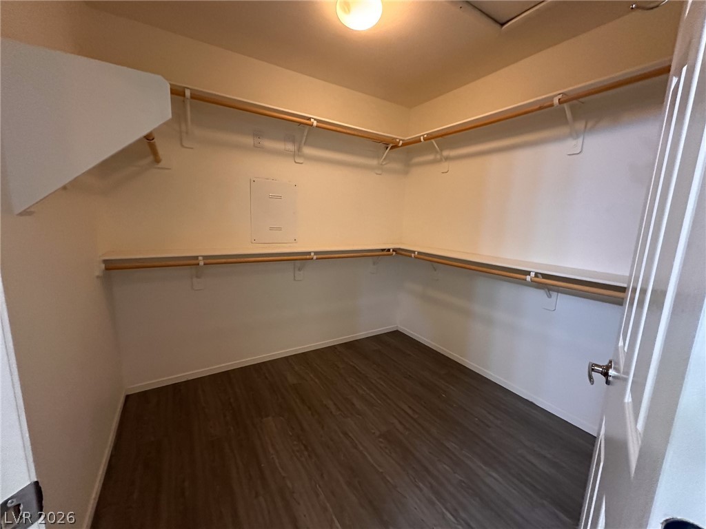 10934 Ketchikan Street Las Vegas, NV 89179 - Photo 6 of 30 Walk in closet featuring dark wood finished floors