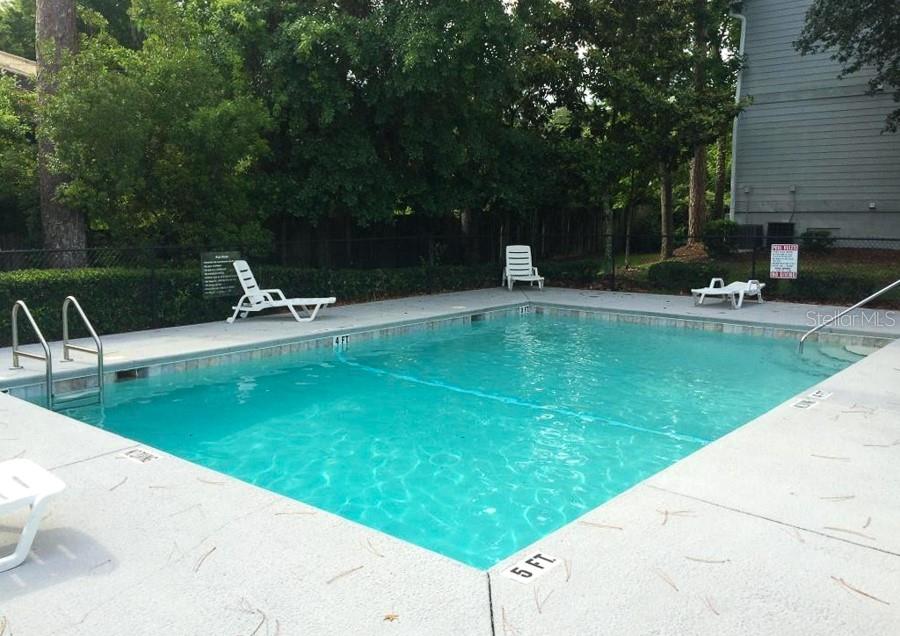 2905 Southwest Archer Road, Unit 4002 Gainesville, FL 32608 - Photo 8 of 8 a view of a swimming pool with a patio