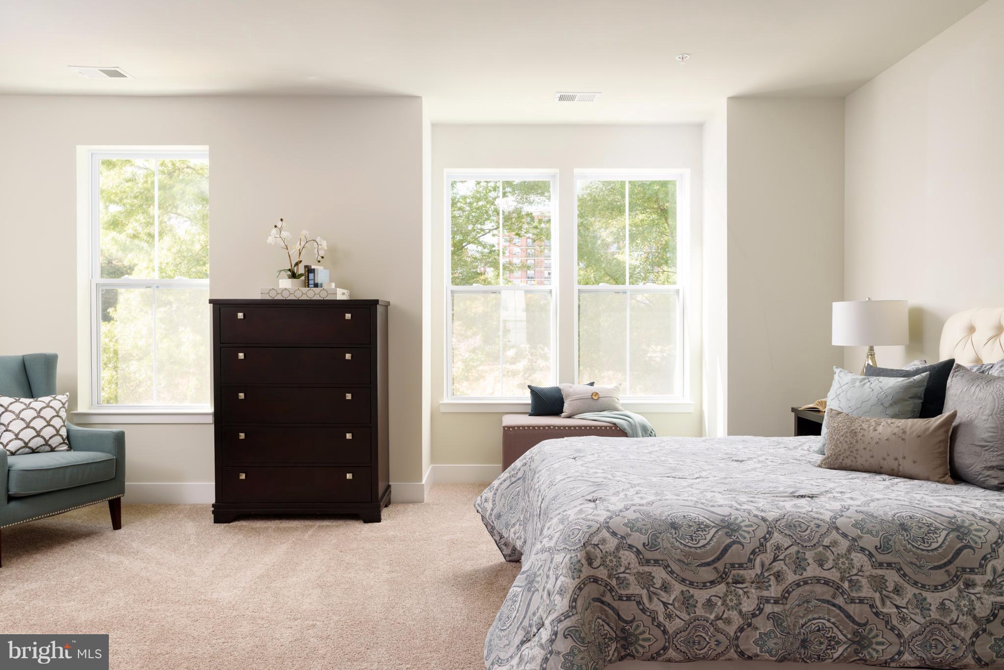 1985 Roland Clarke Place Reston, VA 20191 - Photo 16 of 24 a bedroom with a bed and a window