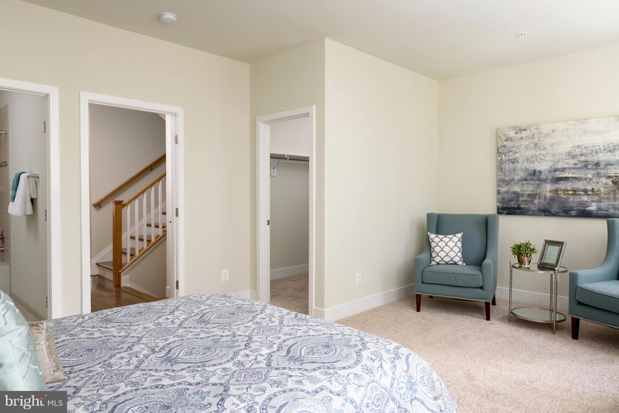 1985 Roland Clarke Place Reston, VA 20191 - Photo 17 of 24 a bedroom with a bed and a couch