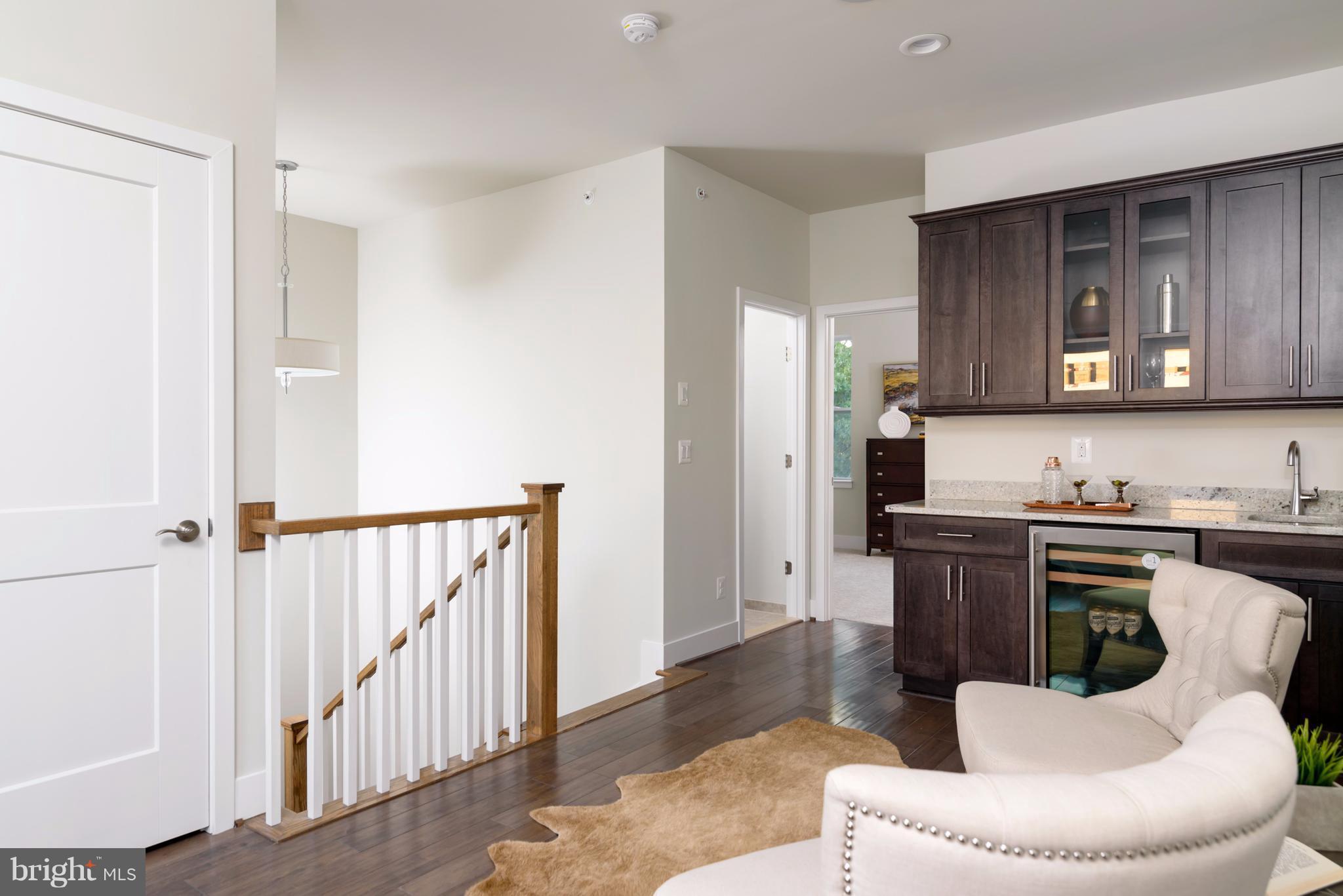 1985 Roland Clarke Place Reston, VA 20191 - Photo 19 of 24 a living room with stainless steel appliances kitchen island granite countertop furniture a refrigerator a stove a sink and dishwasher