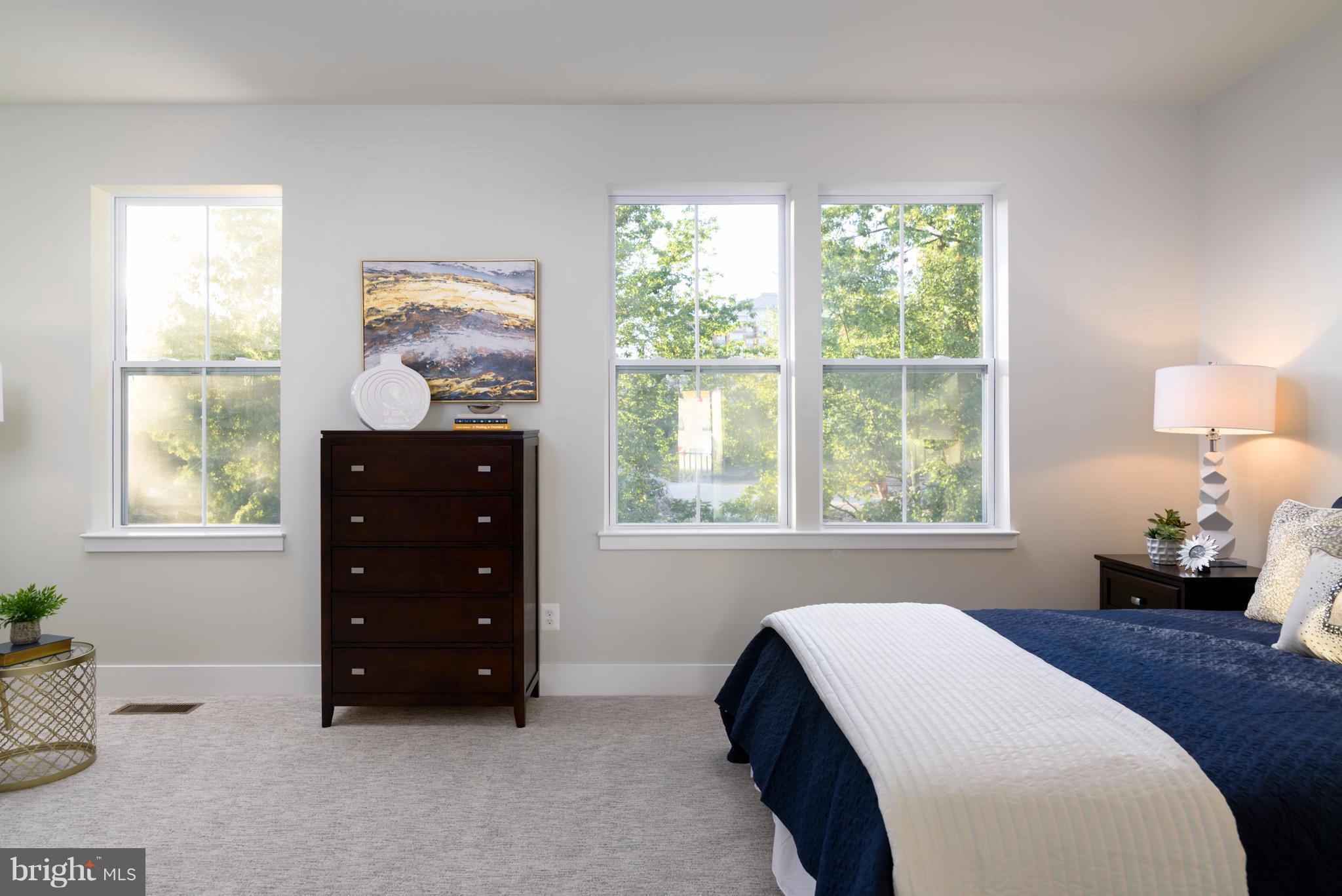 1985 Roland Clarke Place Reston, VA 20191 - Photo 20 of 24 a bedroom with a bed and a window