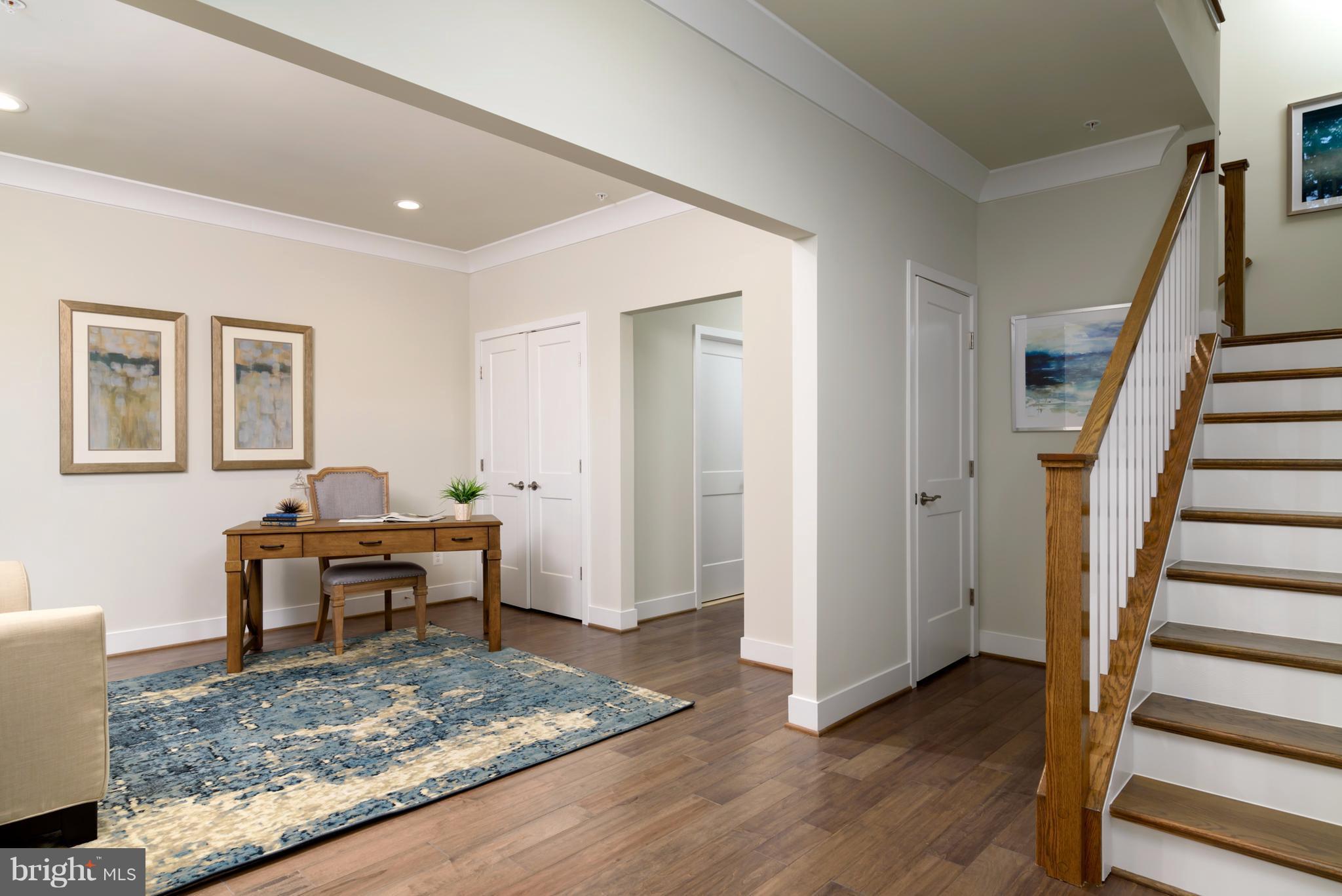 1985 Roland Clarke Place Reston, VA 20191 - Photo 5 of 24 a view of a livingroom with wooden floor and furniture