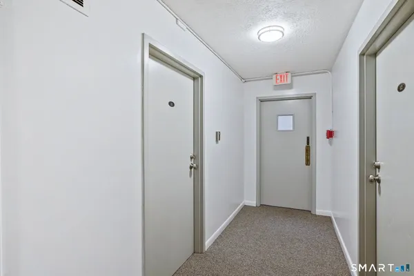 a view of a hallway with closet