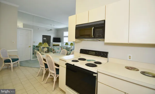 a bed room with a bed and a chair