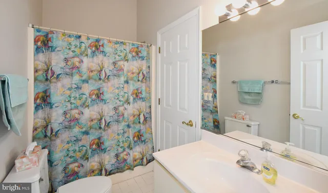 a view of a patio with a table and chairs