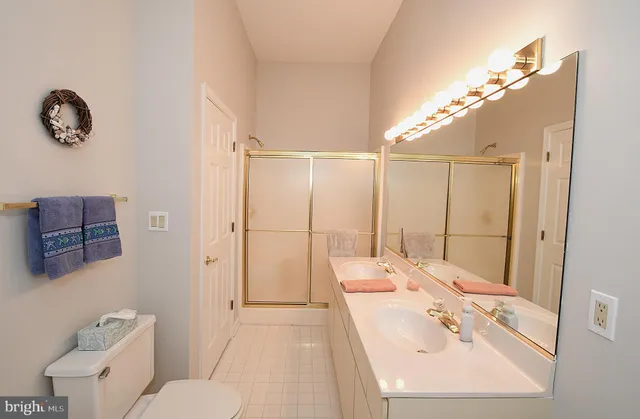 a view of a patio with dining table and chairs with wooden floor and fence