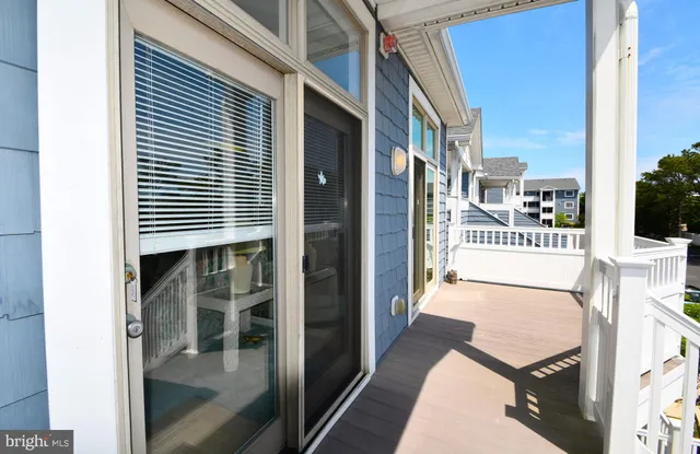 a view of a swimming pool and lounge chairs