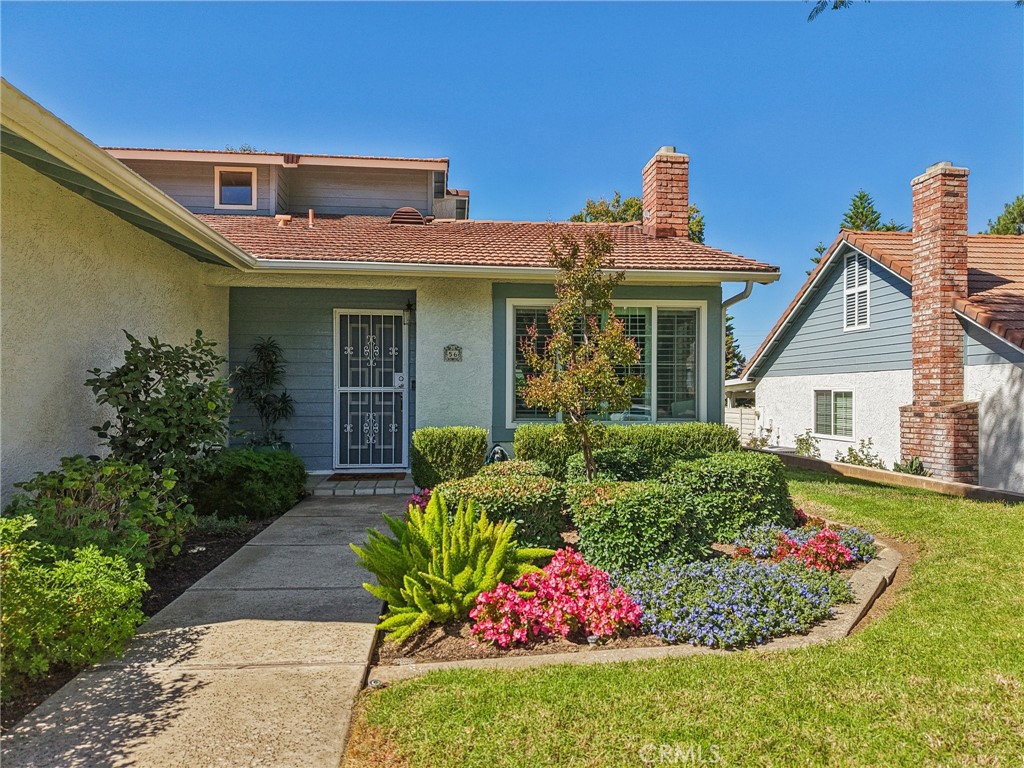 56 Dearborn Circle Redlands, CA 92374 - Photo 3 of 50 a front view of a house with a yard