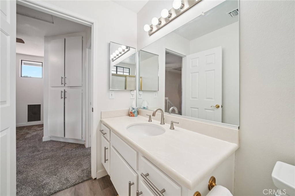 56 Dearborn Circle Redlands, CA 92374 - Photo 31 of 50 a bathroom with a sink a toilet and shower