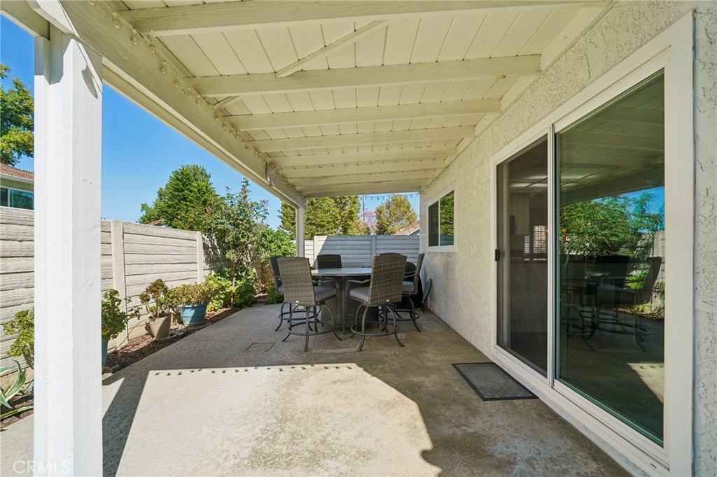 56 Dearborn Circle Redlands, CA 92374 - Photo 36 of 50 a view of a patio with table and chairs and potted plants
