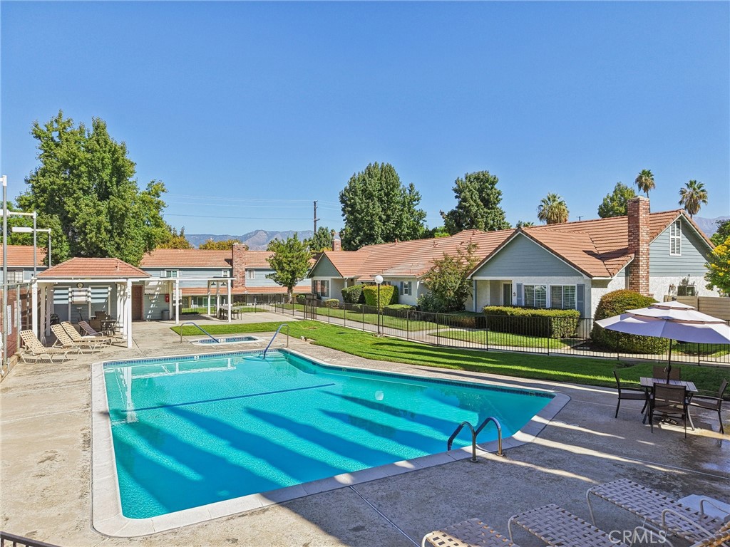 56 Dearborn Circle Redlands, CA 92374 - Photo 46 of 50 a view of house with outdoor space and swimming pool