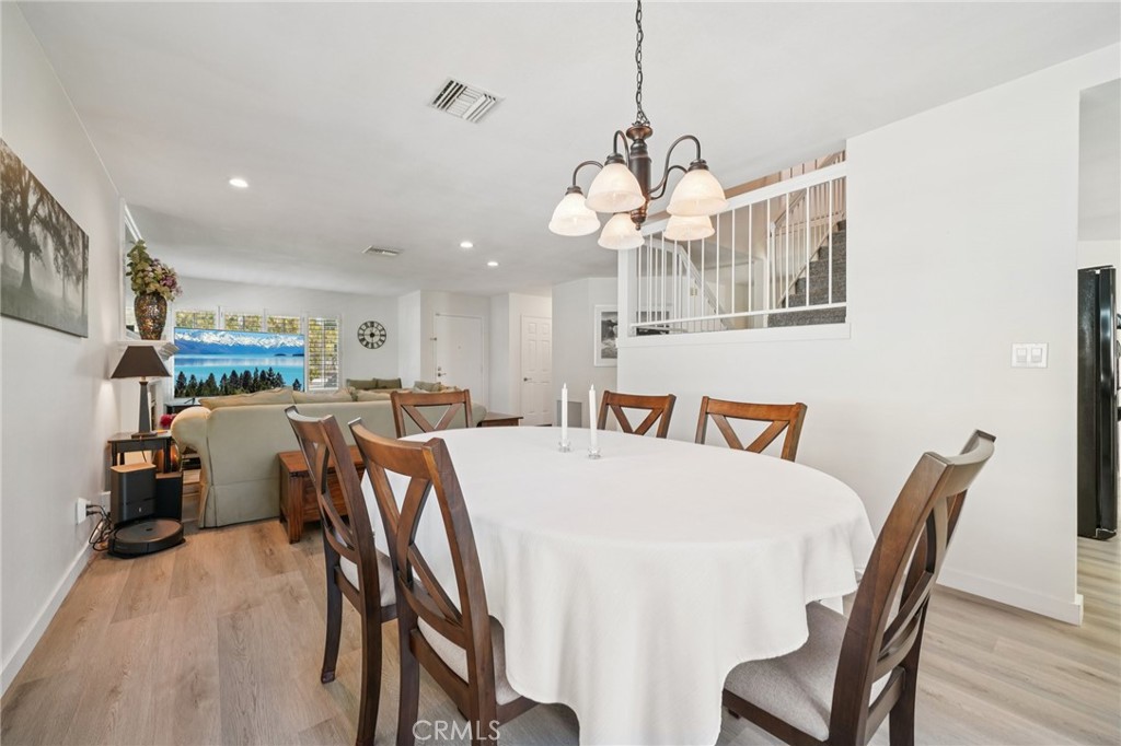 56 Dearborn Circle Redlands, CA 92374 - Photo 7 of 50 a view of a dining room with furniture and wooden floor