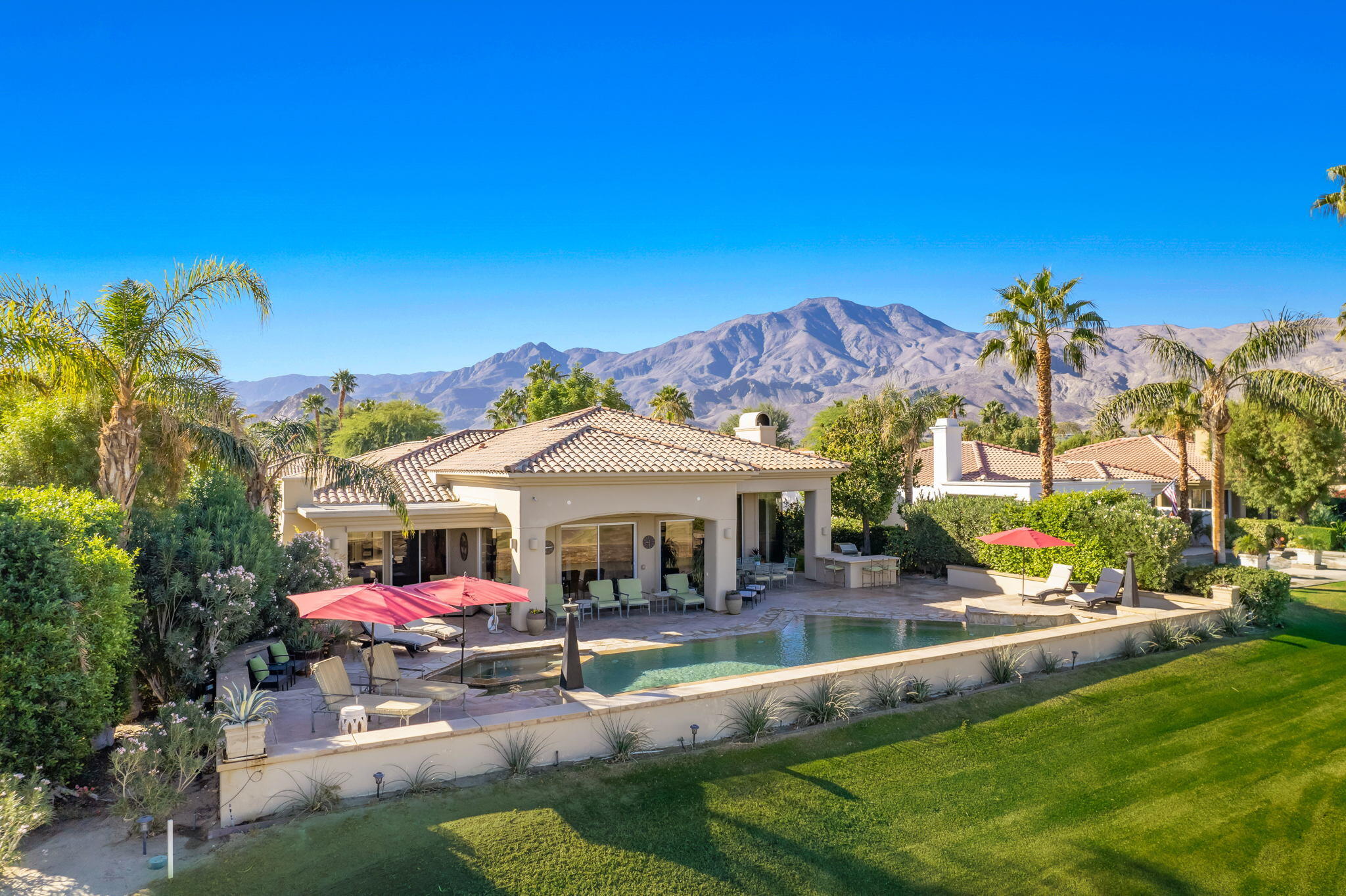 80128 Riviera La Quinta, CA 92253 - Photo 1 of 33 a view of a house with a swimming pool