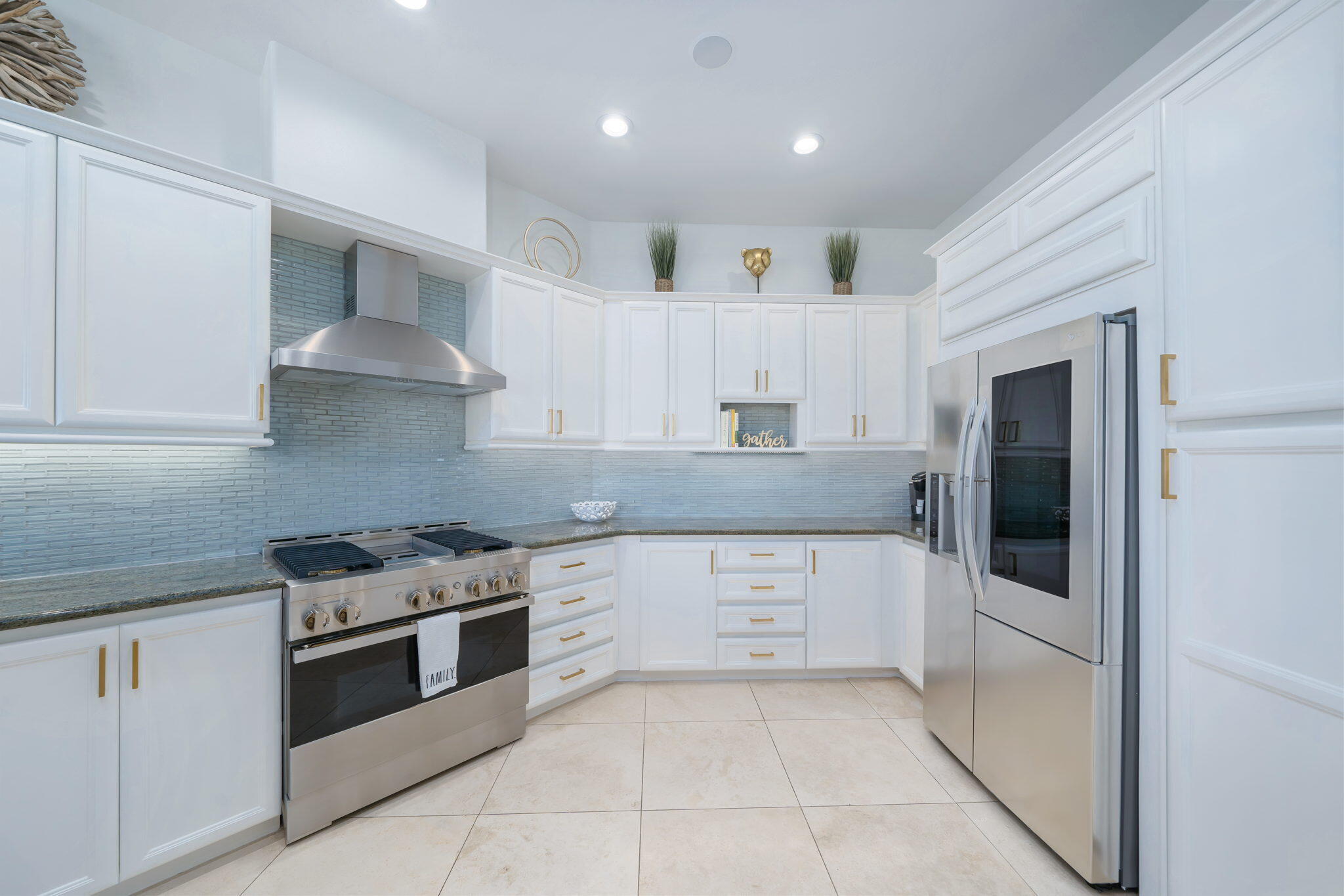 80128 Riviera La Quinta, CA 92253 - Photo 16 of 33 a kitchen with stainless steel appliances granite countertop a stove and a refrigerator