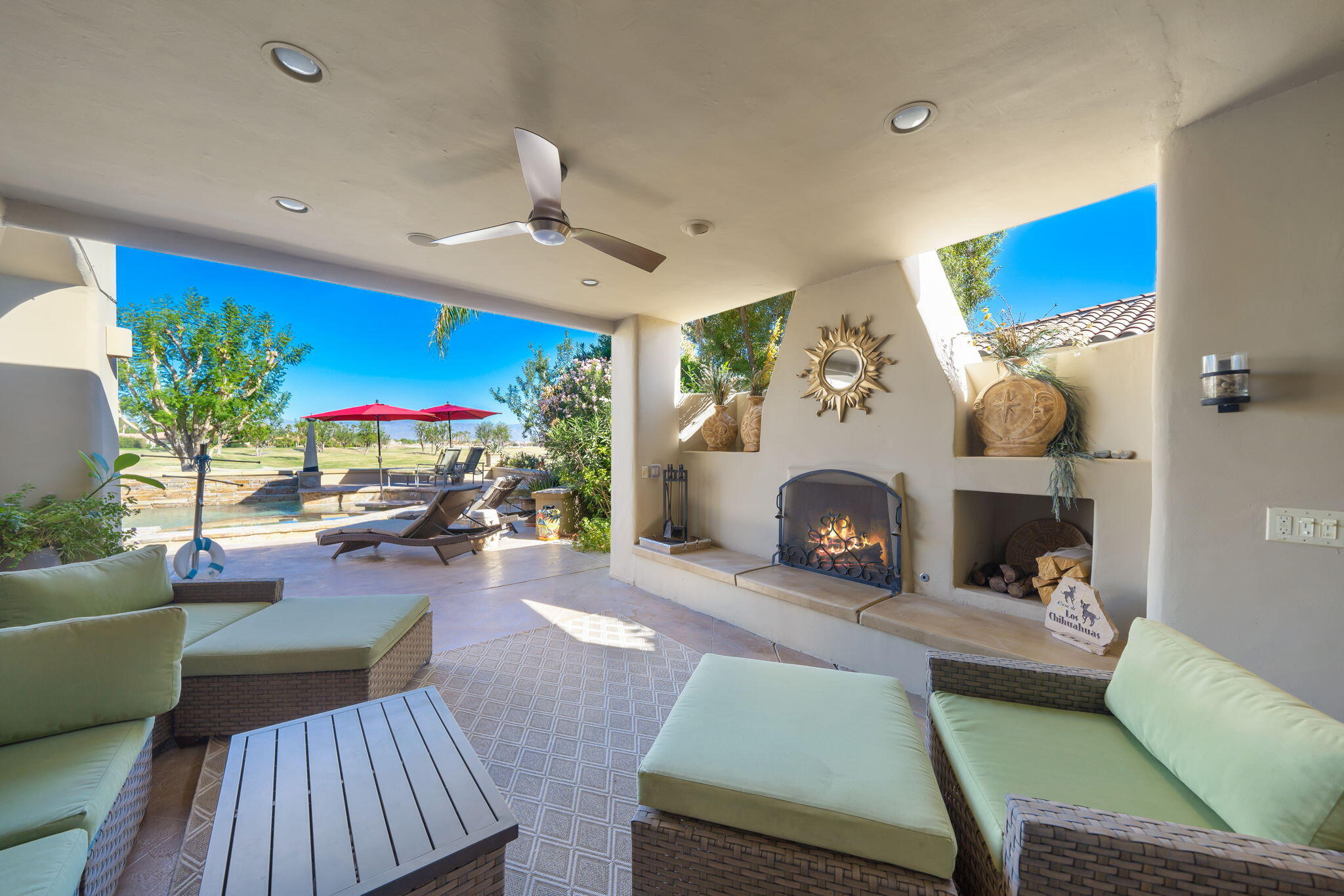80128 Riviera La Quinta, CA 92253 - Photo 21 of 33 a living room with furniture and a fireplace