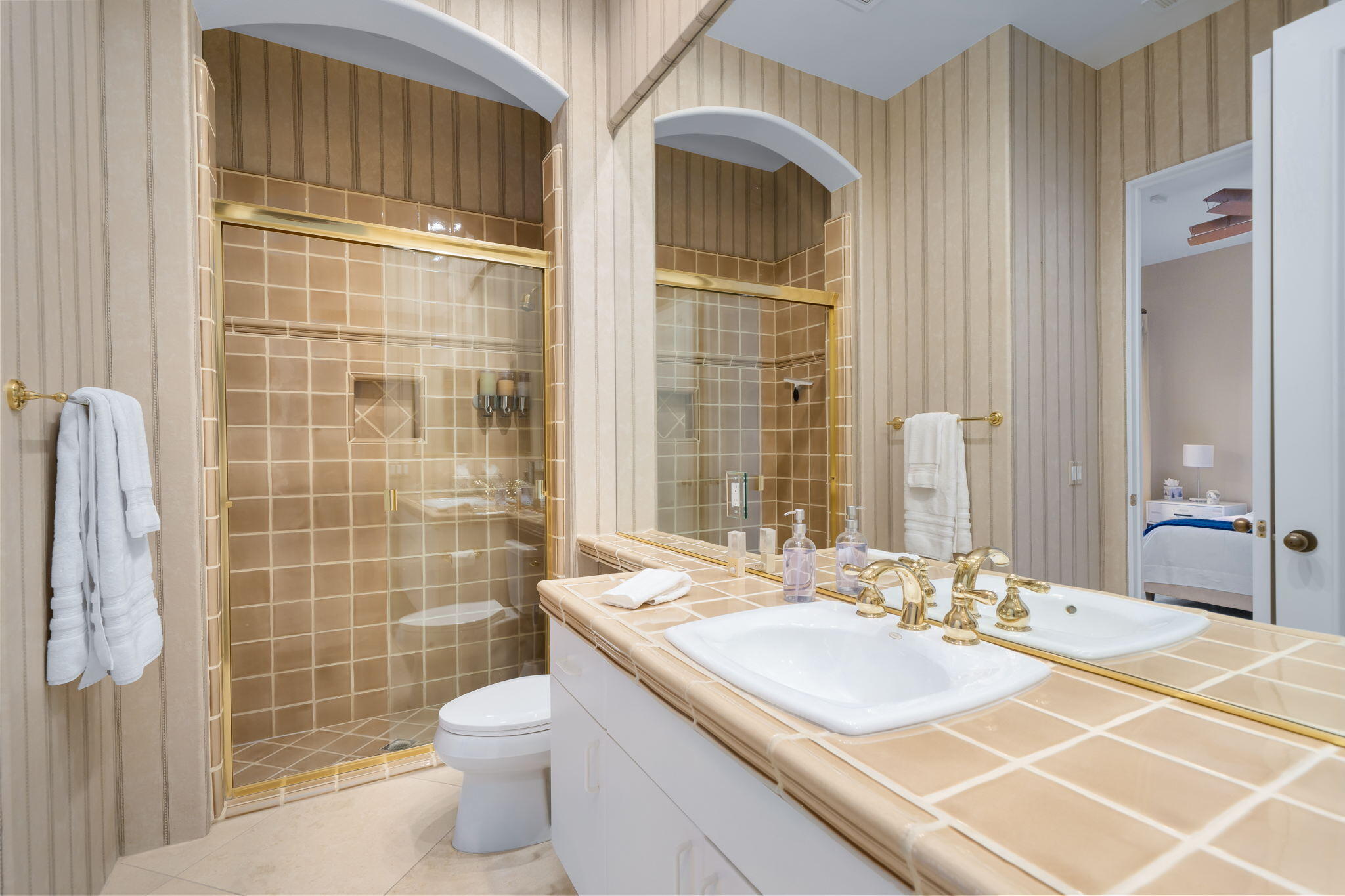 80128 Riviera La Quinta, CA 92253 - Photo 23 of 33 a bathroom with a sink a toilet and shower