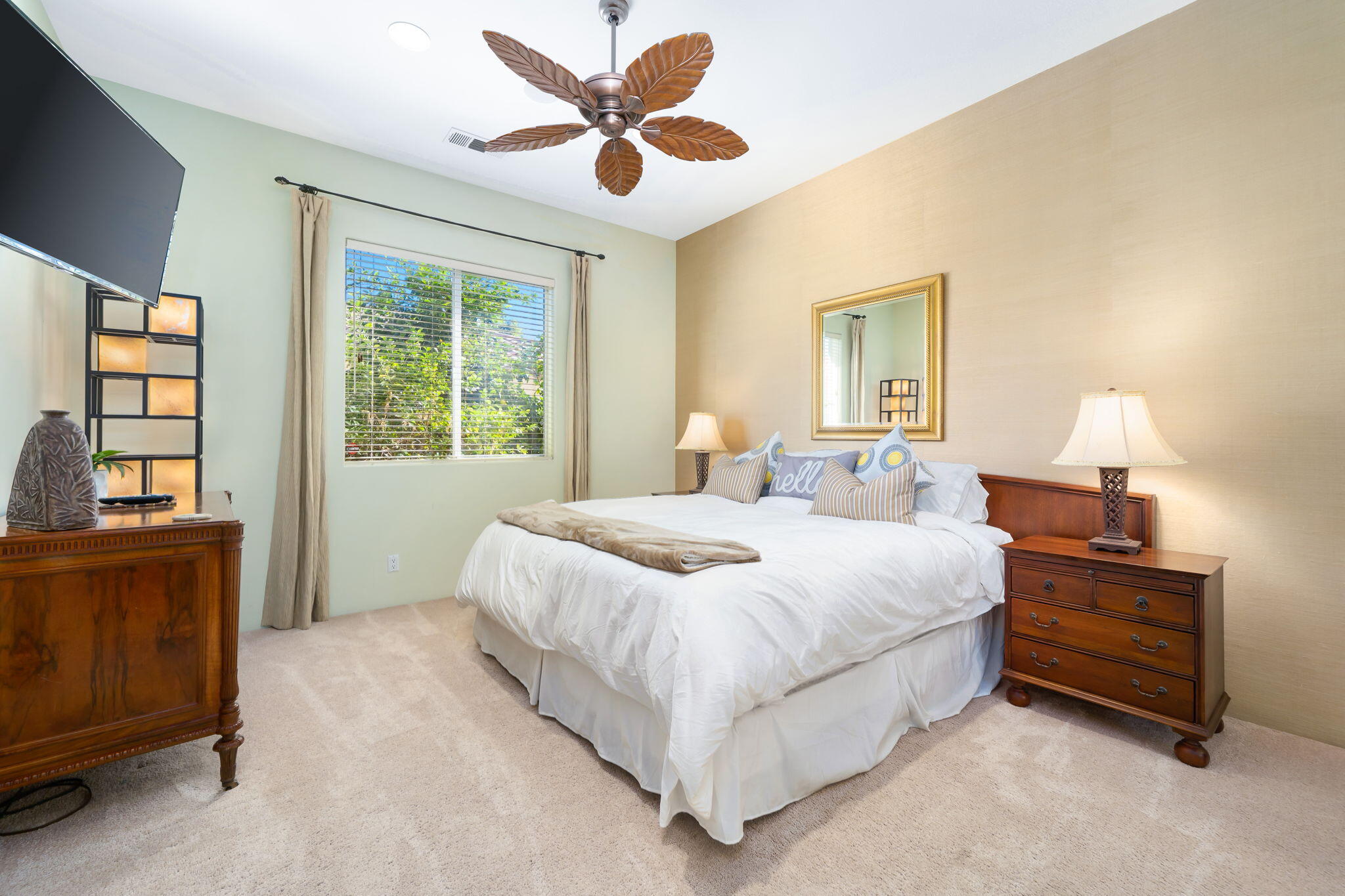 80128 Riviera La Quinta, CA 92253 - Photo 24 of 33 a bedroom with a bed and a chandelier