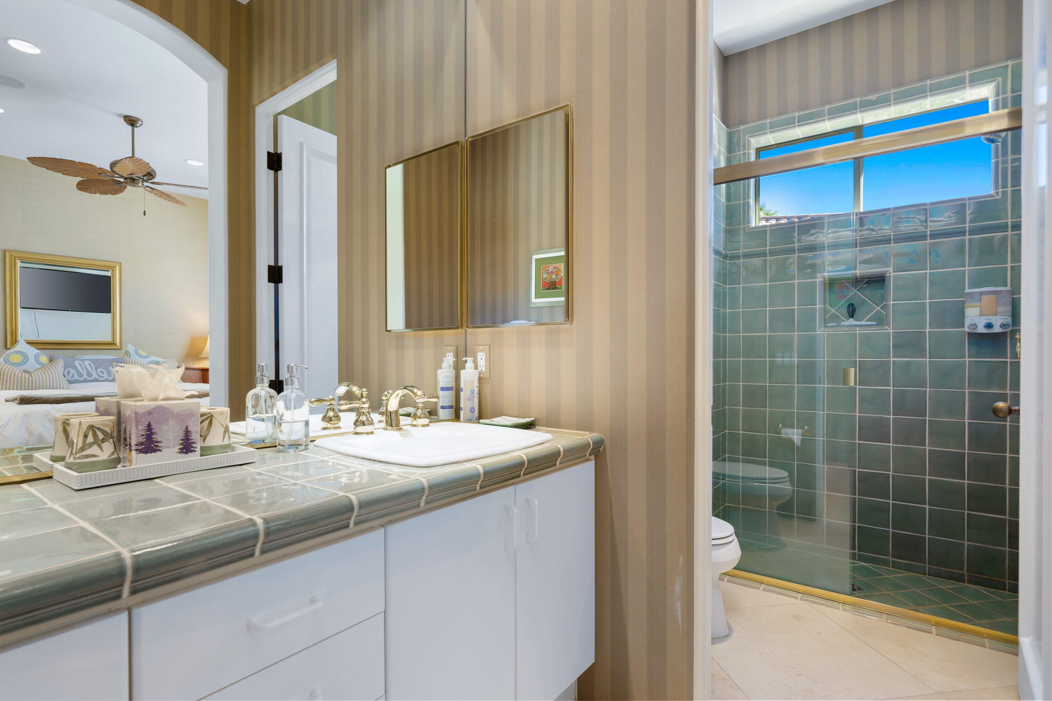 80128 Riviera La Quinta, CA 92253 - Photo 25 of 33 a bathroom with a sink and a mirror