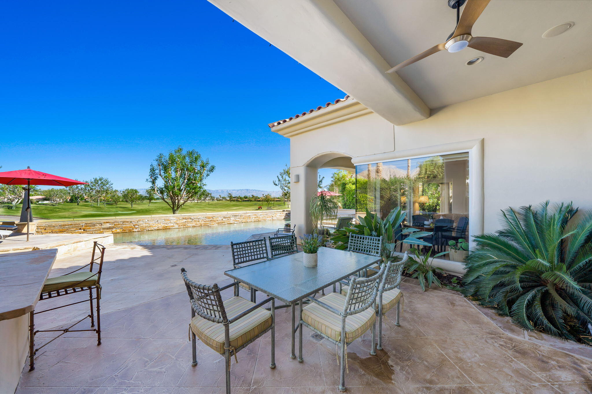 80128 Riviera La Quinta, CA 92253 - Photo 30 of 33 a view of a swimming pool and outdoor seating