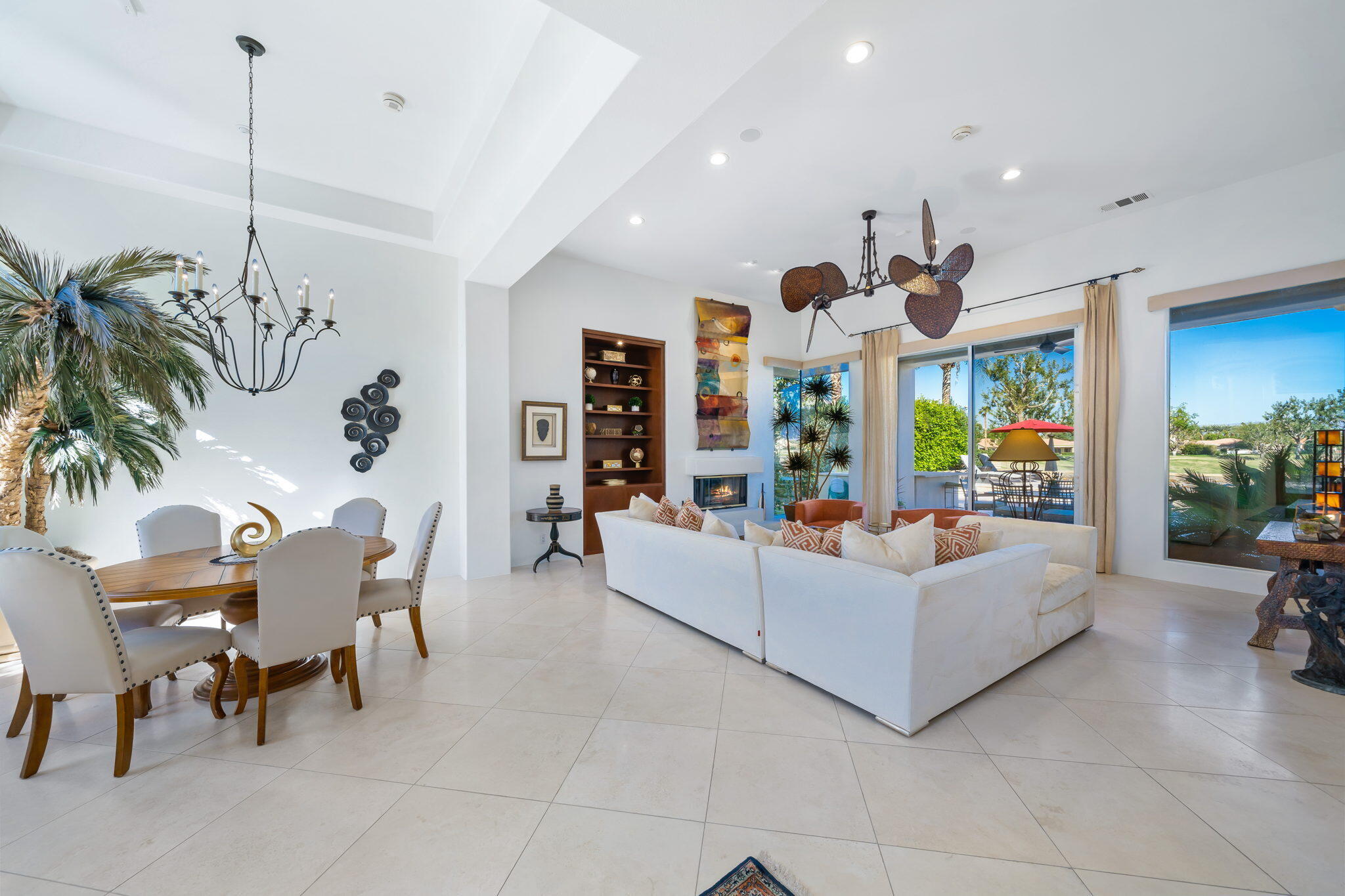 80128 Riviera La Quinta, CA 92253 - Photo 5 of 33 a living room with furniture and a chandelier