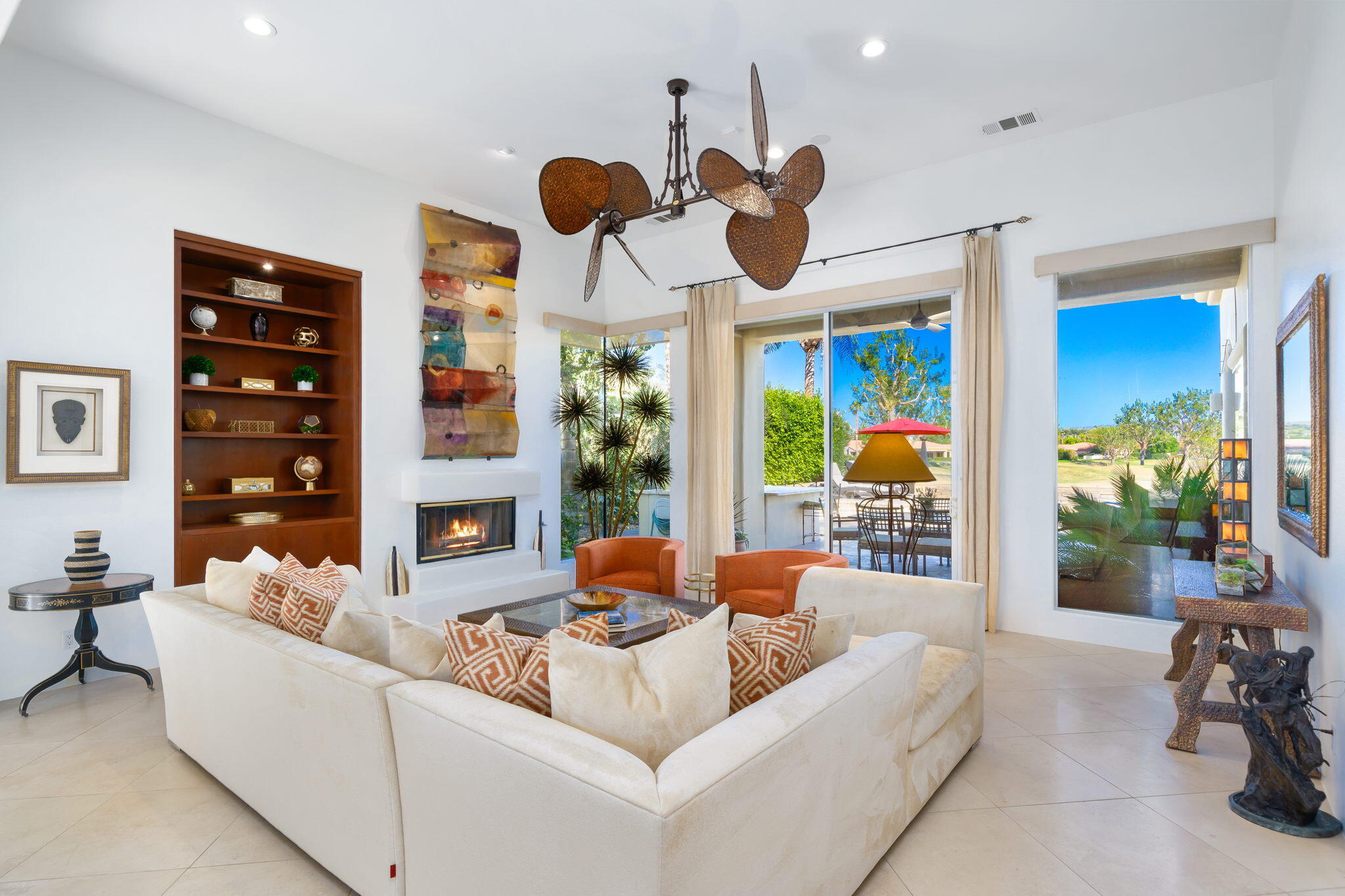80128 Riviera La Quinta, CA 92253 - Photo 8 of 33 a living room with fireplace furniture and a large window